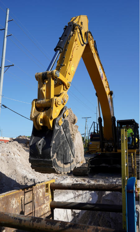 Picture showing an excavator performing open cut construction