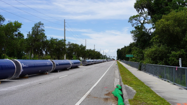 Image of pipe strung out along Boyette Road